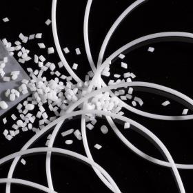 A selection of pellets, filaments and foils placed in front of a black background based on Desmomelt U® powder.